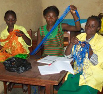 Girls learning macrame