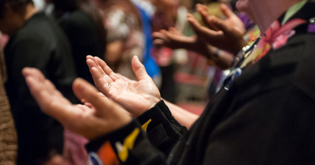 Hands lifted in prayer