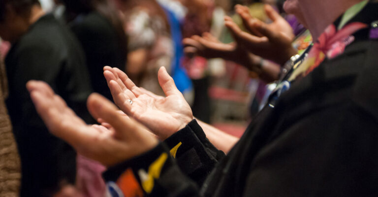 Hands lifted in prayer
