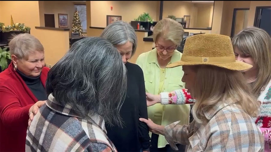 Susan Boucard Praying for Staff